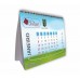 Calendário Mesa Base Papel Supremo 350g 14x21cm 4x0 cores Acab. Plast. - Miolo 12 pág. Papel couchê 150g 21x13cm 4x4 cores c/ Wire-o 500 unid.